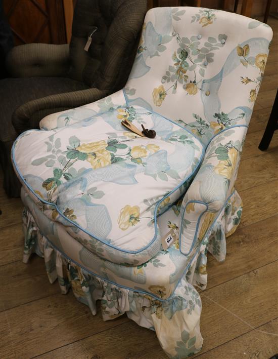 An early Victorian ladies armchair raised on ebonised turned legs
